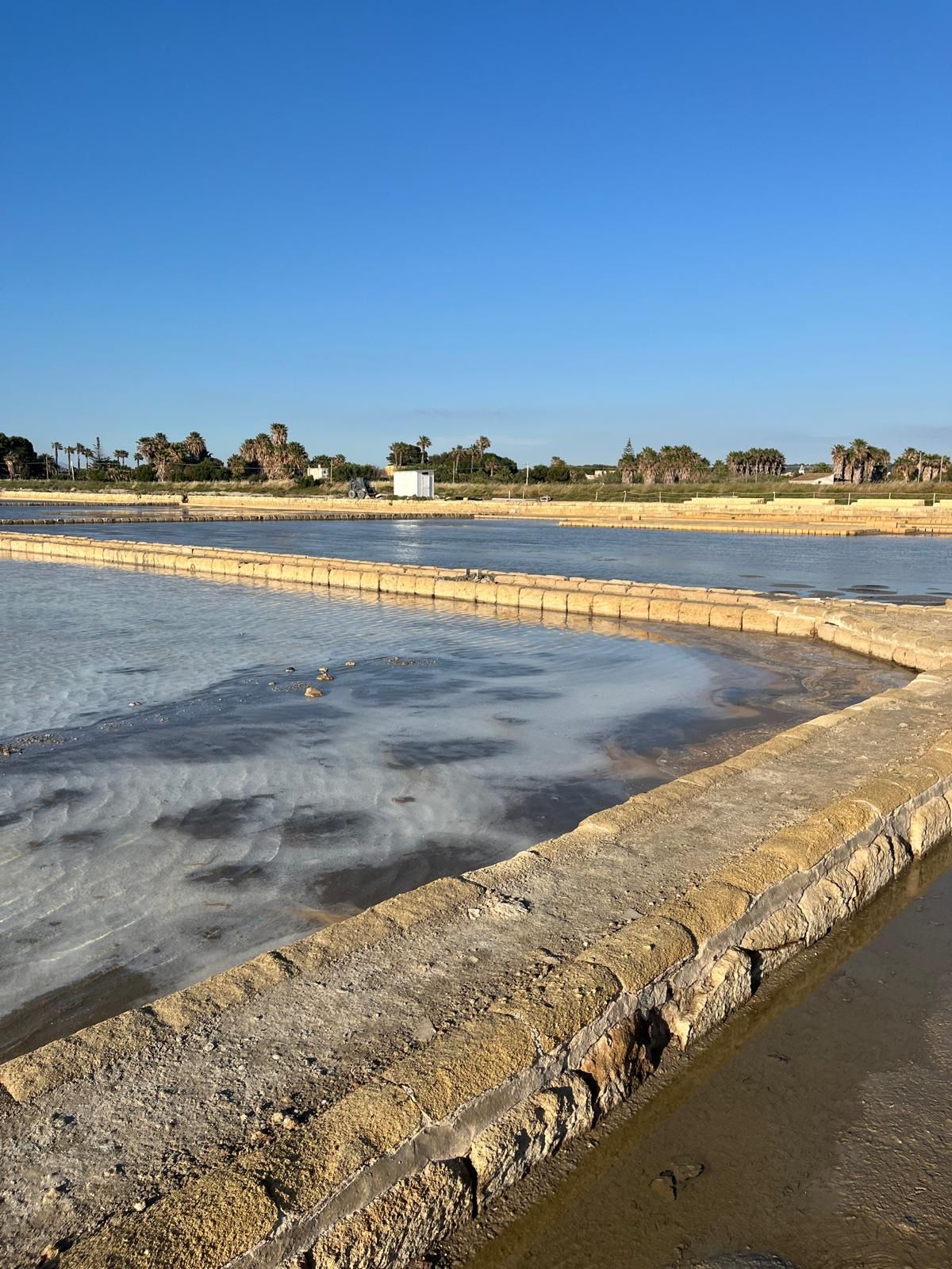 The salt pans of Marsala under a clear sky